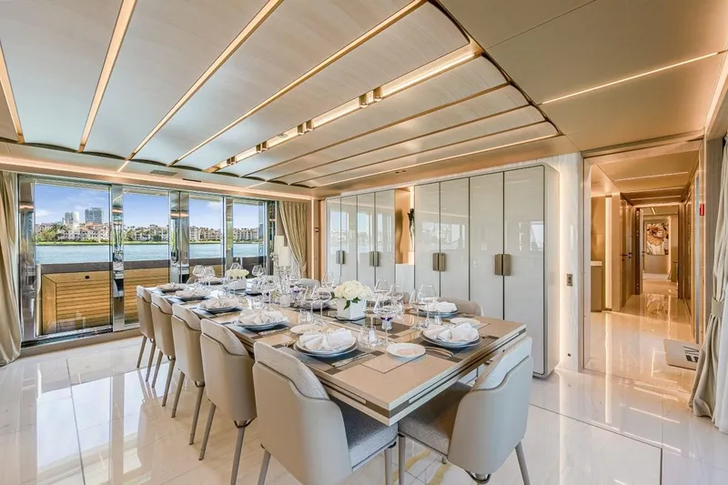 Slide: The Image of Luxurious dining area on 2020 Rossinavi Custom yacht with elegant table setting and waterfront view. - 8