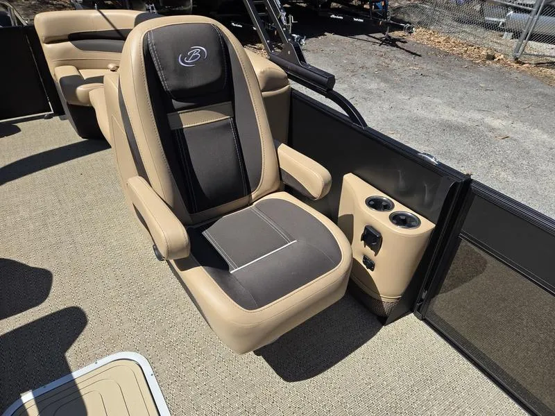 Slide: The Image of 2025 Barletta C22QC boat seat with cup holders, featuring beige and black upholstery. - 10
