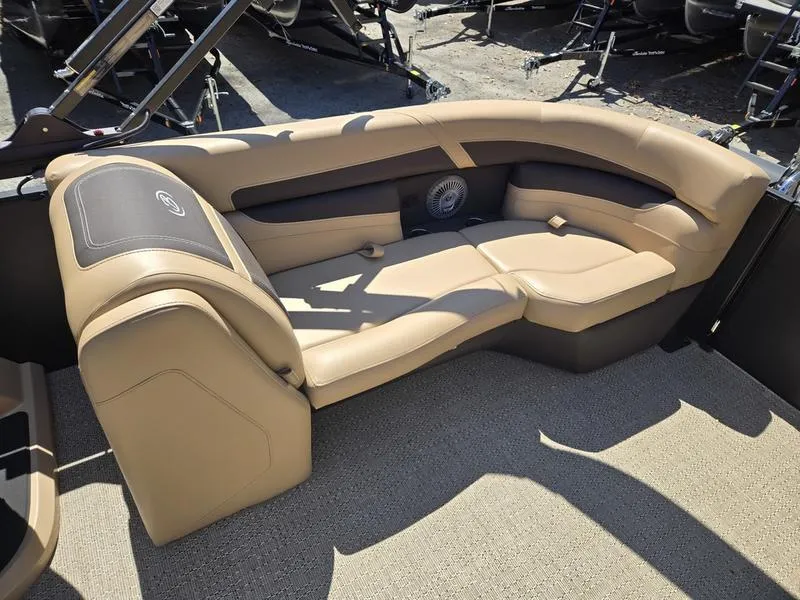 Slide: The Image of Luxurious seating on 2025 Barletta C22QC pontoon boat, featuring tan upholstery and spacious design. - 12