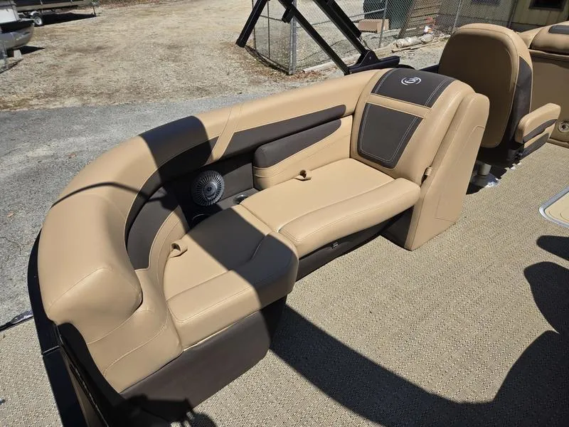 Slide: The Image of 2025 Barletta C22QC boat interior with beige seating and speaker system. - 13