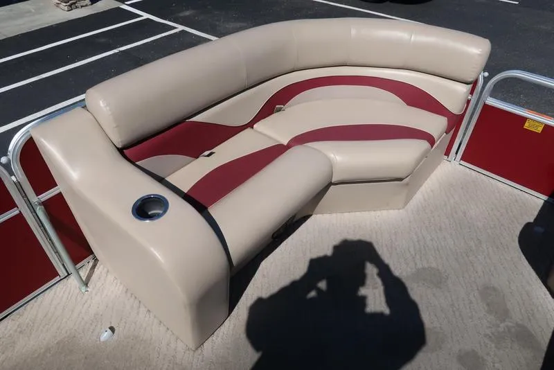 Slide: The Image of 2012 Berkshire G210CL boat seating with beige and red upholstery, featuring a built-in cup holder. - 18