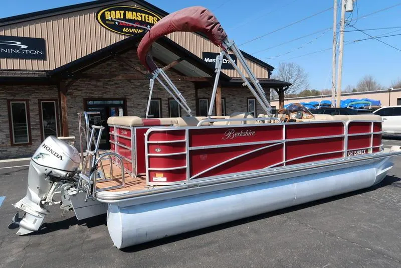 Slide: The Image of 2012 Berkshire G210CL pontoon boat with Honda outboard motor, parked at Boat Masters Marine. - 3