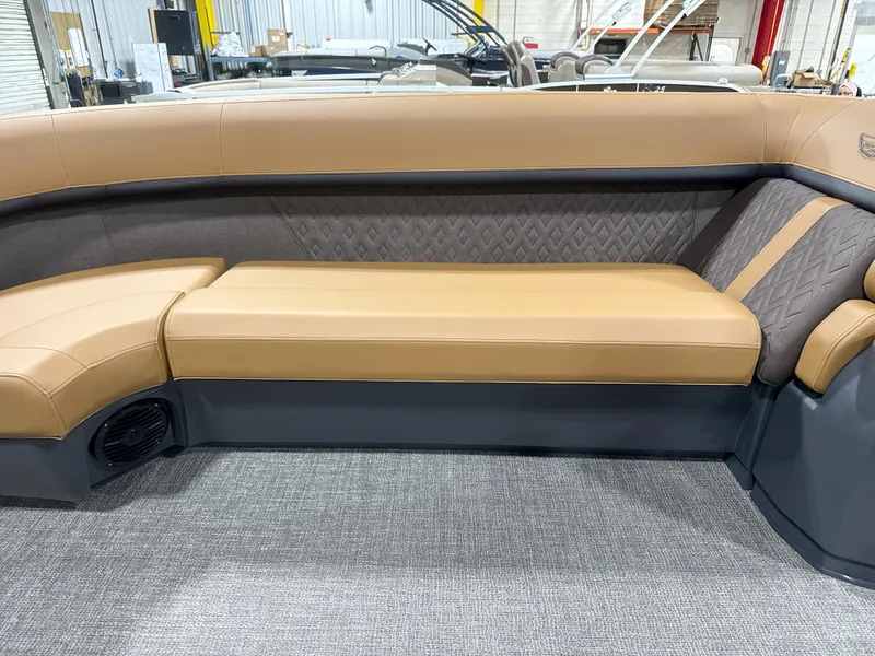 Slide: The Image of 2025 Bennington M Quad Bench 24 MFB with tan and gray upholstery in a showroom. - 4