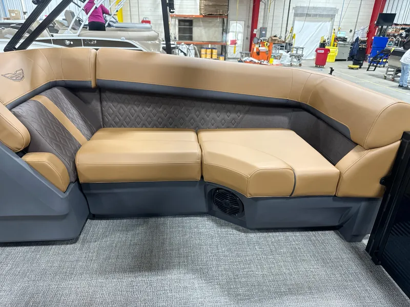 Slide: The Image of Luxurious seating on 2025 Bennington M Quad Bench 24 MFB boat, featuring tan upholstery. - 6