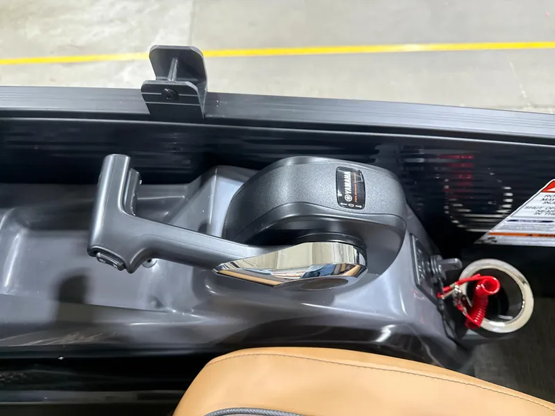 Slide: The Image of Throttle control of 2025 Bennington M Quad Bench 24 MFB boat, featuring sleek design and ergonomic handle. - 8