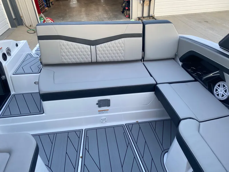 Slide: The Image of 2025 Monterey 278 Super Sport boat interior with gray seating and modern design. - 12