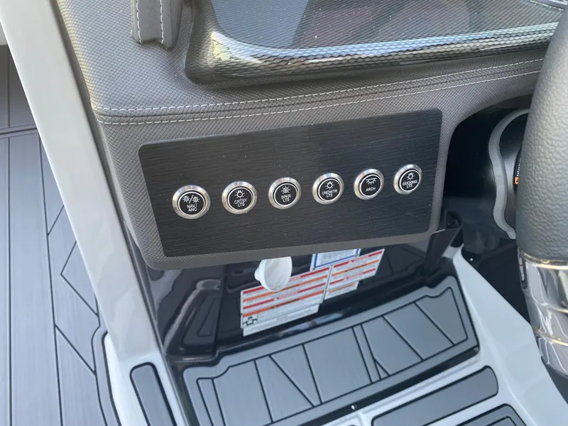 Slide: The Image of Dashboard controls of 2025 Monterey 278 Super Sport boat, featuring sleek design and modern buttons. - 21