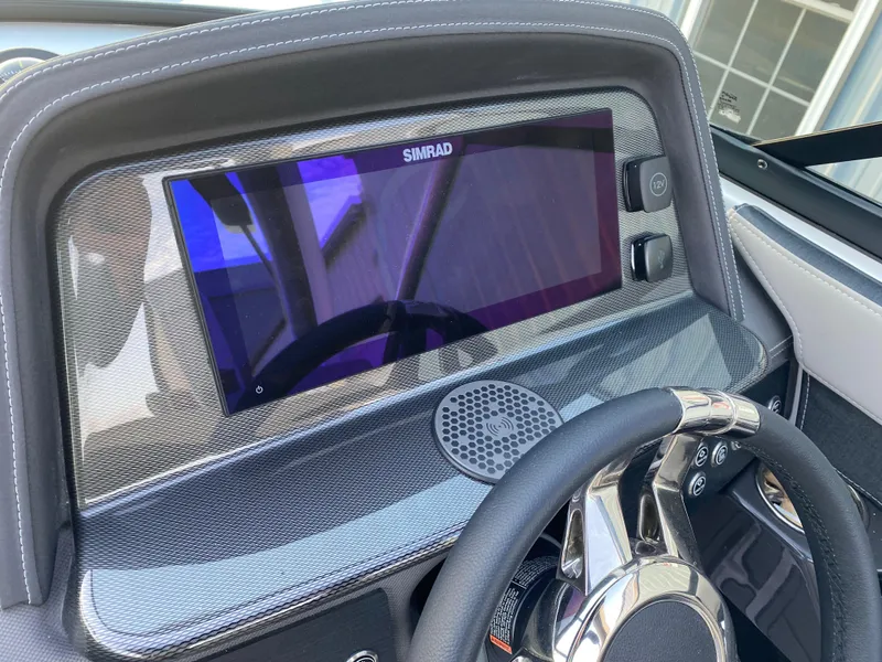 Slide: The Image of Dashboard of 2025 Monterey 278 Super Sport boat with Simrad display and steering wheel. - 22