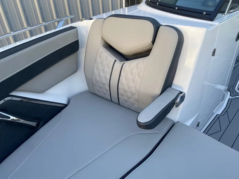 Slide: The Image of 2025 Monterey 278 Super Sport boat seat with elegant quilted design and armrest. - 25