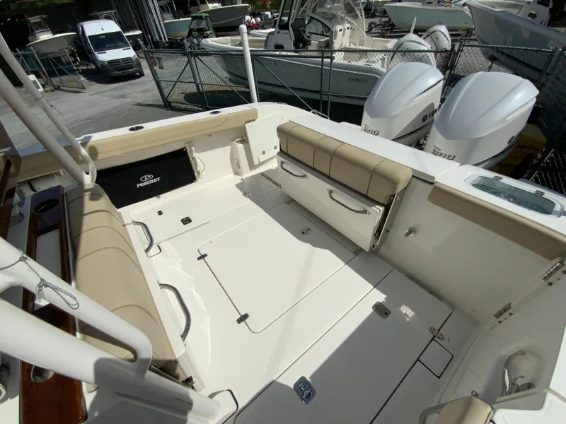 Slide: The Image of 2020 Pursuit S 288 Sport boat interior with seating and storage compartments. - 11