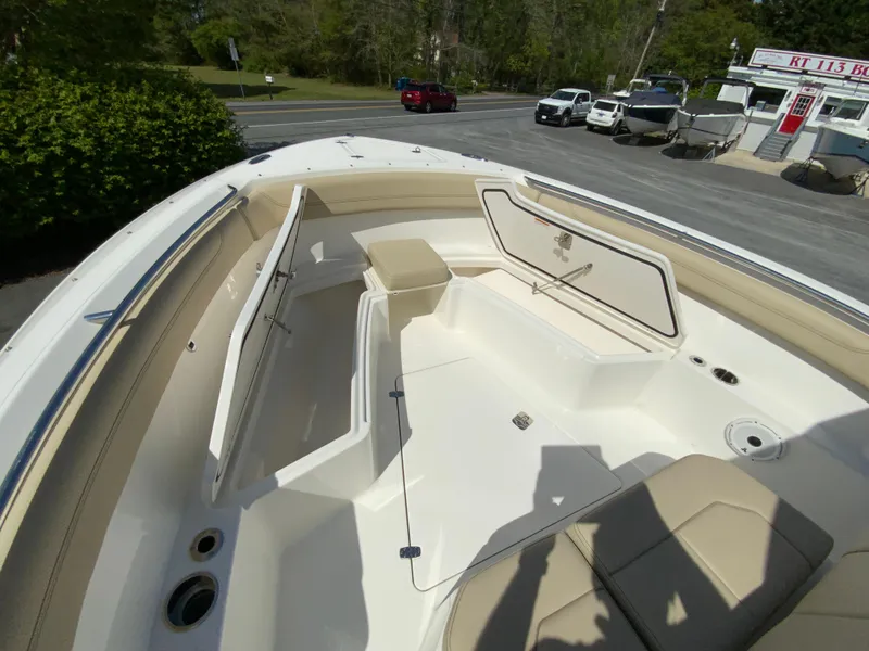 Slide: The Image of 2020 Pursuit S 288 Sport boat interior with seating and storage compartments. - 20