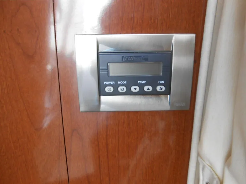 Slide: The Image of Control panel on 2008 Sea Ray 280 Sundancer boat, mounted on wooden surface. - 10