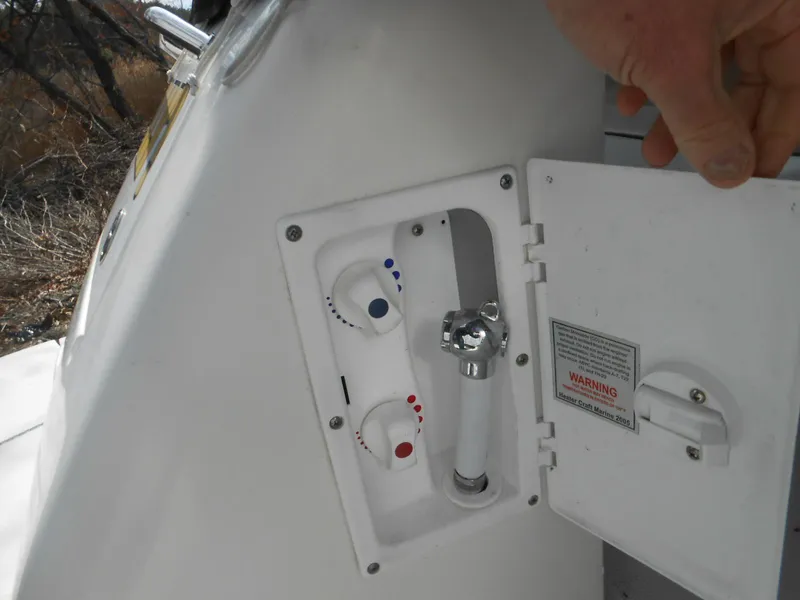 Slide: The Image of 2008 Sea Ray 280 Sundancer shower controls with open access panel. - 16