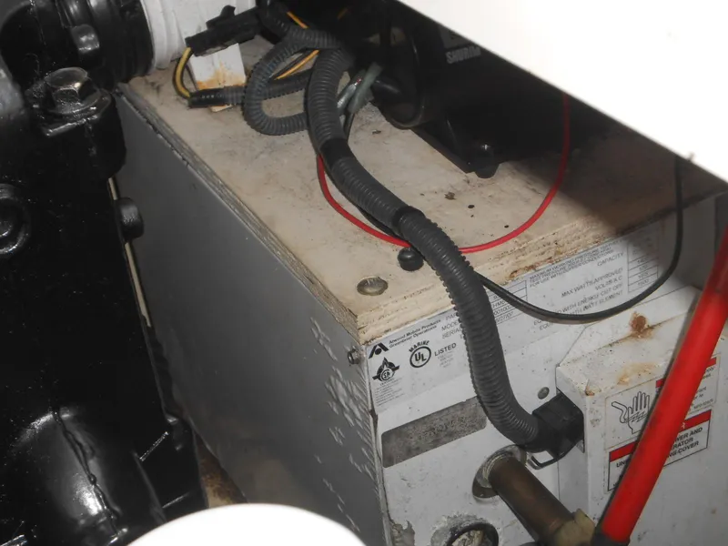 Slide: The Image of Engine compartment of 2008 Sea Ray 280 Sundancer with visible wiring and components. - 23