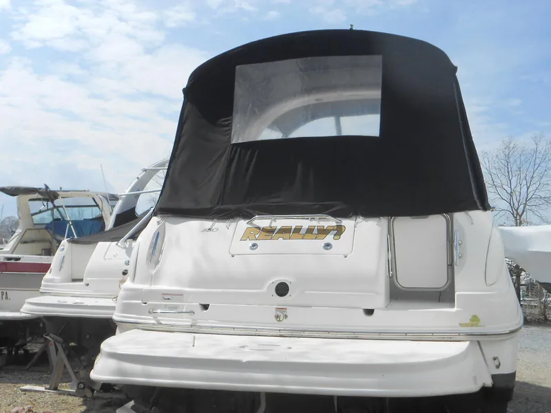 Slide: The Image of 2008 Sea Ray 280 Sundancer boat with black canvas cover, rear view. - 3