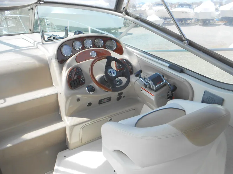 Slide: The Image of 2008 Sea Ray 280 Sundancer helm with steering wheel and instrument panel. - 5