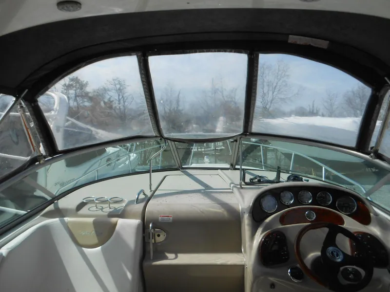 Slide: The Image of 2008 Sea Ray 280 Sundancer cockpit with steering wheel and dashboard view. - 7