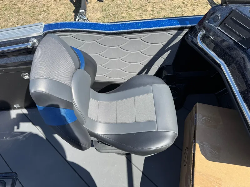 Slide: The Image of 2025 Nitro ZV20 Sport Pro boat seat with gray and blue design, next to a cardboard box. - 8