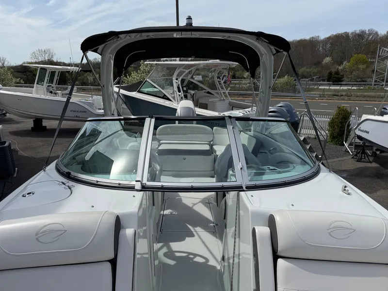 Slide: The Image of 2019 Crownline 290 XSS boat with sleek design and spacious seating. - 1