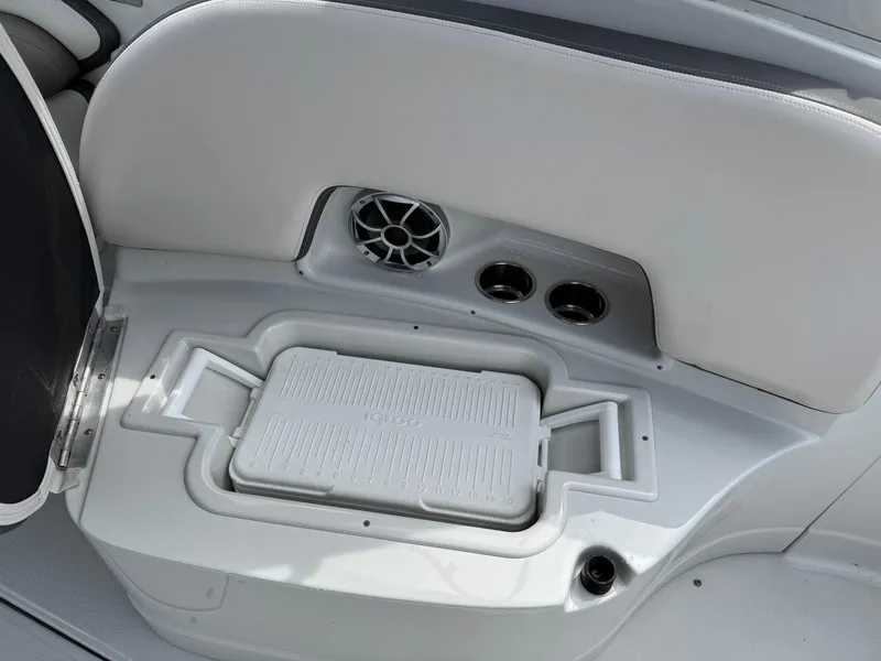 Slide: The Image of 2019 Crownline 290 XSS boat interior with speaker and cup holders. - 16