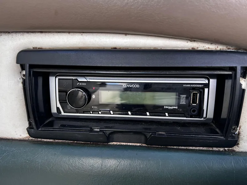 Slide: The Image of Kenwood stereo system in a 2001 Glastron GS 229 boat dashboard. - 11