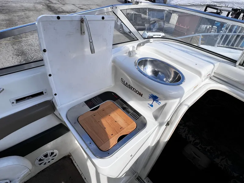 Slide: The Image of 2001 Glastron GS 229 boat interior with sink and cutting board. - 7