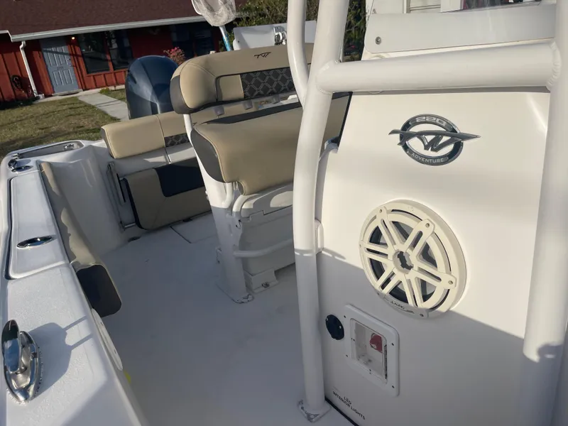 Slide: The Image of 2022 Tidewater Adventure boat interior with seating and speaker system. - 23