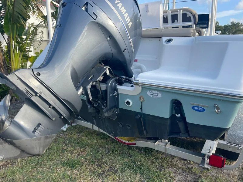 Slide: The Image of 2022 Tidewater Adventure boat with Yamaha outboard motor on trailer. - 30