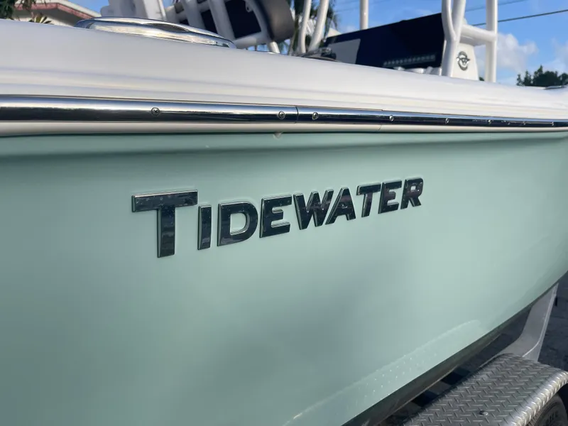 Slide: The Image of 2022 Tidewater Adventure boat side view with logo and sleek design. - 34