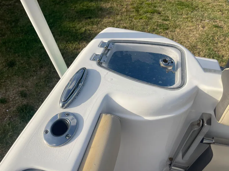 Slide: The Image of 2022 Tidewater Adventure boat detail with hatch and rod holder on deck. - 39