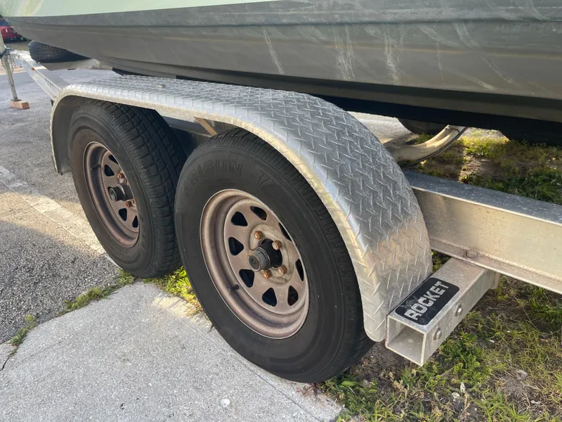 Slide: The Image of Trailer with dual wheels for 2022 Tidewater Adventure boat. - 42