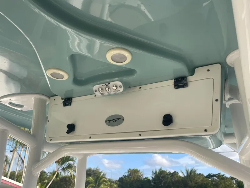 Slide: The Image of 2022 Tidewater Adventure boat ceiling with speakers and control panel. - 8