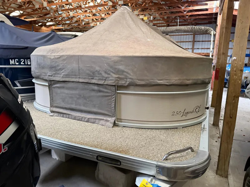 Slide: The Image of 2004 Premier 250 Legend Deluxe RE pontoon boat stored indoors. - 8