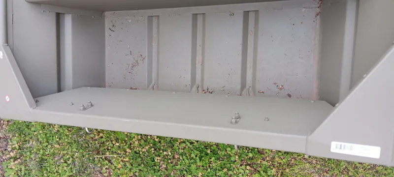 Slide: The Image of 2024 Tracker Grizzly 1236 Jon boat interior, showcasing durable construction and spacious design. - 5