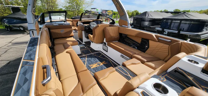 Slide: The Image of Luxurious interior of 2025 Tigé Ultre ZX boat with tan leather seating. - 10