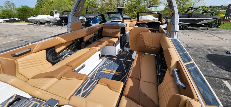 Slide: The Image of 2025 Tigé Ultre ZX boat interior with luxurious tan seating and modern design. - 11