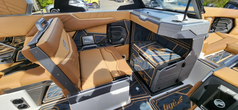 Slide: The Image of 2025 Tigé Ultre ZX boat interior with luxurious tan seating and modern design elements. - 15