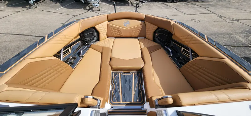 Slide: The Image of 2025 Tigé Ultre ZX boat interior with luxurious tan seating and modern design. - 17