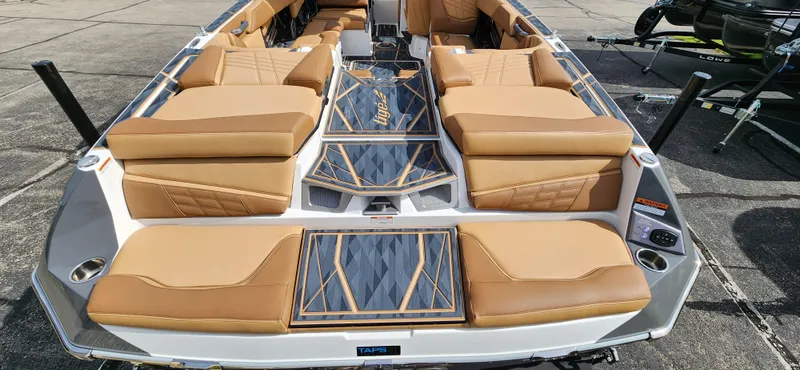Slide: The Image of 2025 Tigé Ultre ZX boat with luxurious tan seating and sleek design. - 8