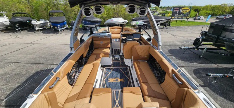 Slide: The Image of 2025 Tigé Ultre ZX boat interior with luxurious tan seating and sleek design. - 9