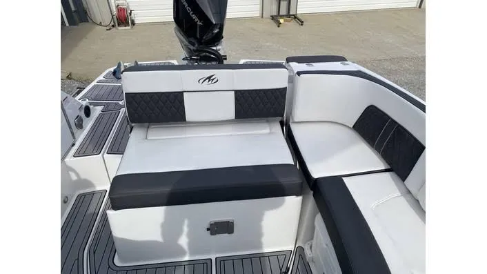 Slide: The Image of 2024 Monterey M-65 boat seating area with black and white upholstery. - 4