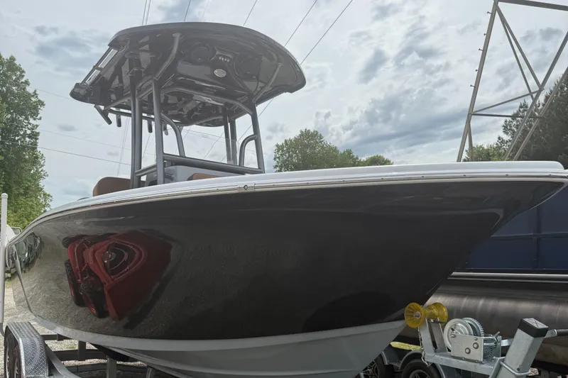 The Image of 2025 Sea Pro 225 Sandbar boat on trailer, under cloudy sky. - 0