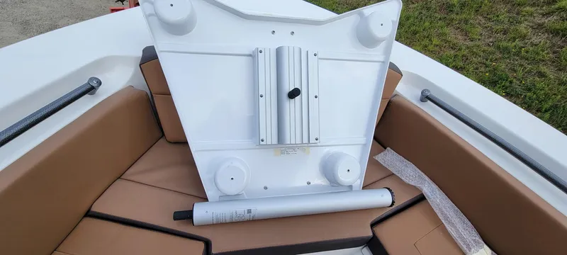 Slide: The Image of 2025 Sea Pro 225 Sandbar boat interior with white panel and tan seating. - 12