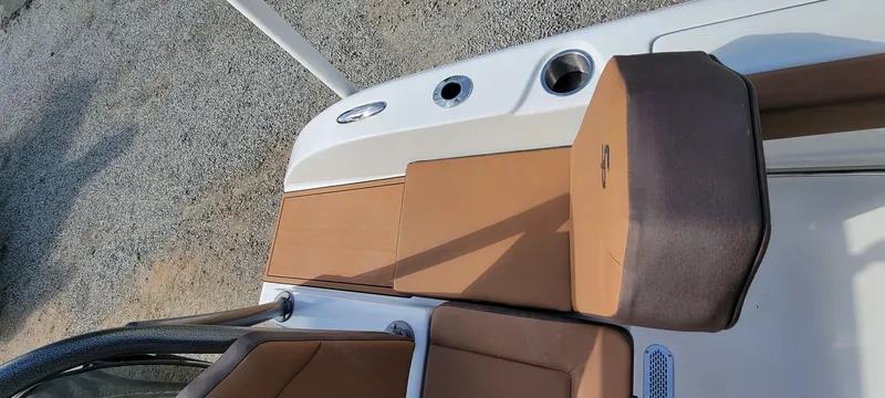 Slide: The Image of 2025 Sea Pro 225 Sandbar boat interior with brown seating and cup holders. - 15