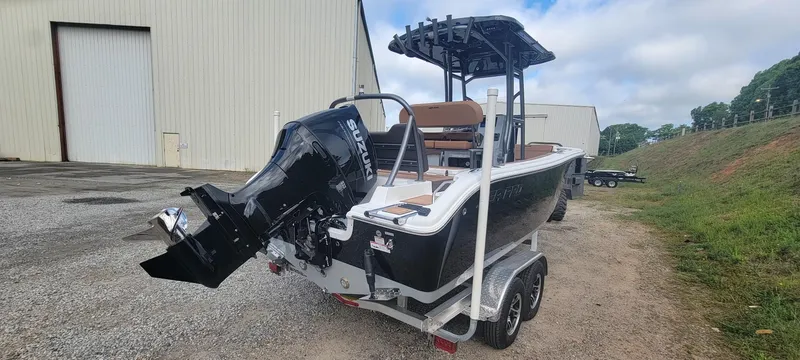 Slide: The Image of 2025 Sea Pro 225 Sandbar boat on trailer, featuring a powerful outboard motor. - 20