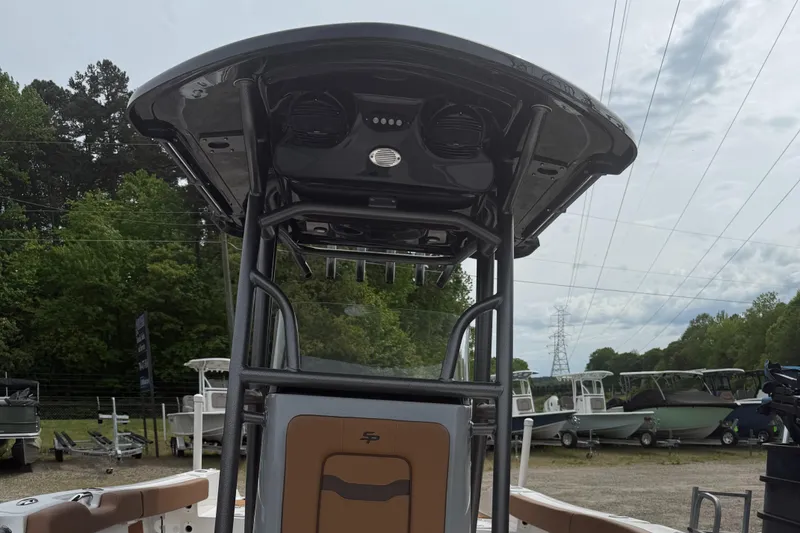 Slide: The Image of 2025 Sea Pro 225 Sandbar boat with T-top, docked outdoors. - 3