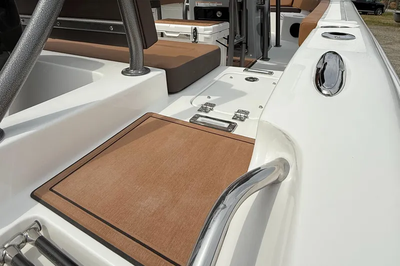 Slide: The Image of 2025 Sea Pro 225 Sandbar boat interior with sleek seating and polished metal accents. - 7