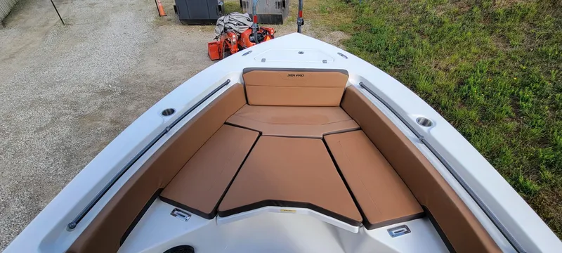 Slide: The Image of 2025 Sea Pro 225 Sandbar boat with tan seating and spacious deck. - 8