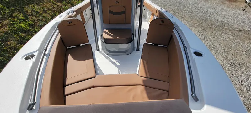 Slide: The Image of 2025 Sea Pro 225 Sandbar boat interior with tan seating and sleek design. - 9