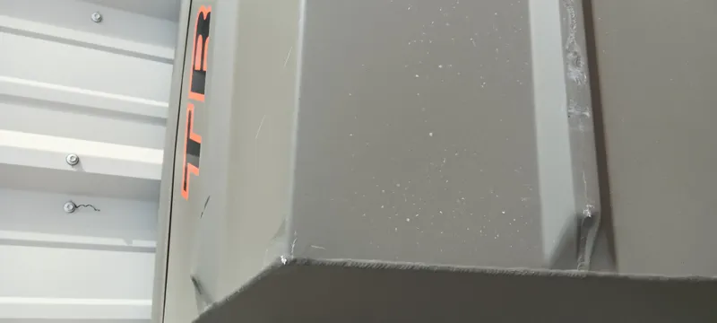 Slide: The Image of 2024 Tracker Grizzly 1036 Jon boat, close-up of gray metal surface and logo. - 14